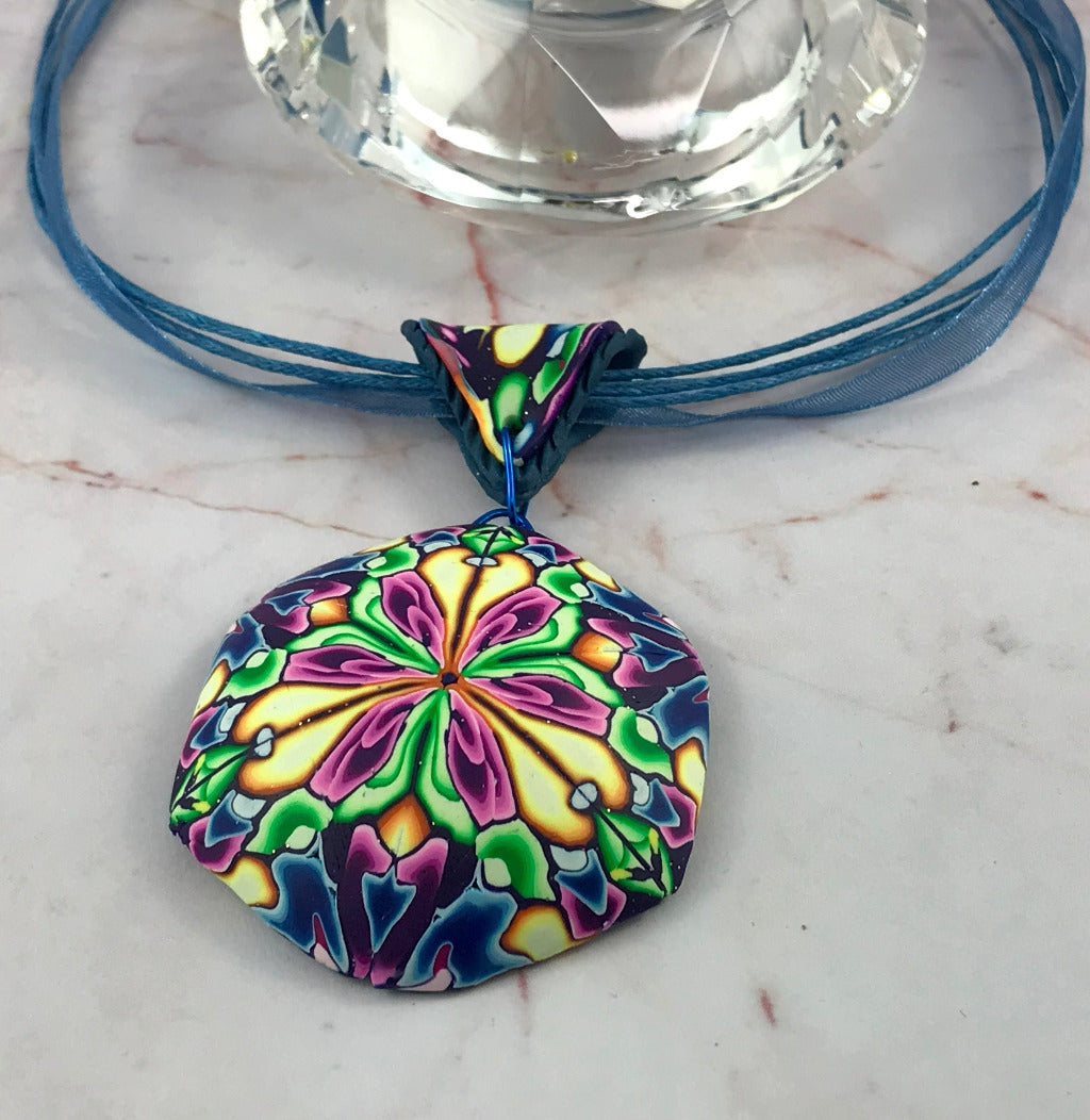 Side view of Rennique bold floral hanging pendant showing curved lightweight handmade polymer clay design