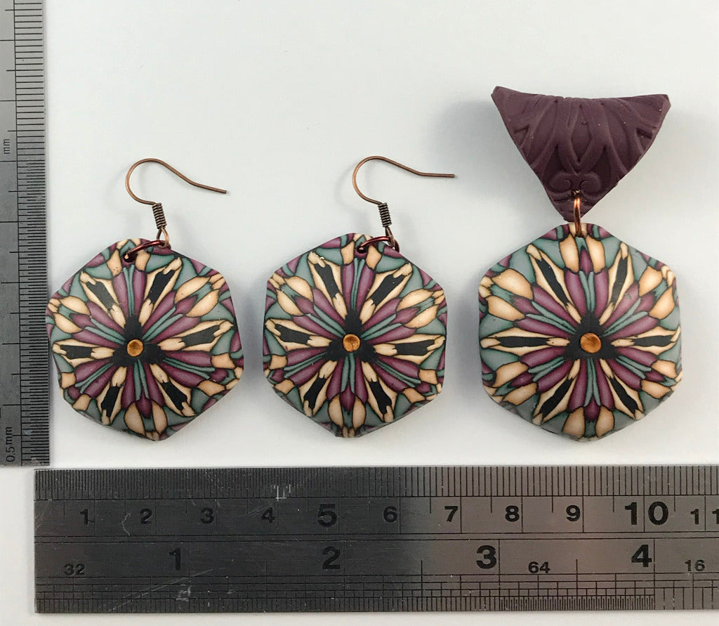 Rennique deep red geometric polymer clay jewellery set featuring handmade pendant necklace, statement earrings and matching artisan bracelet in muted plum, sage and cream abstract tones