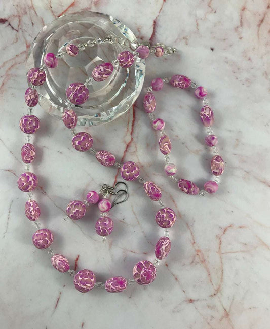 Rennique handmade long pink flower necklace set with matching earrings and bracelet made from polymer clay floral beads.