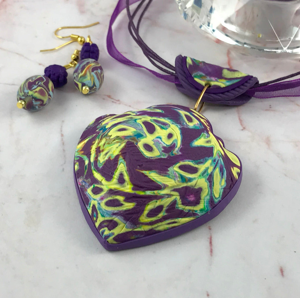 Rennique purple heart swirl handmade jewellery set with matching statement pendant and drop earrings in purple and yellow marbled design