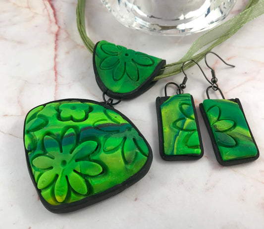 Rennique spring green carved floral pendant and matching earrings handmade polymer clay jewellery set flat lay