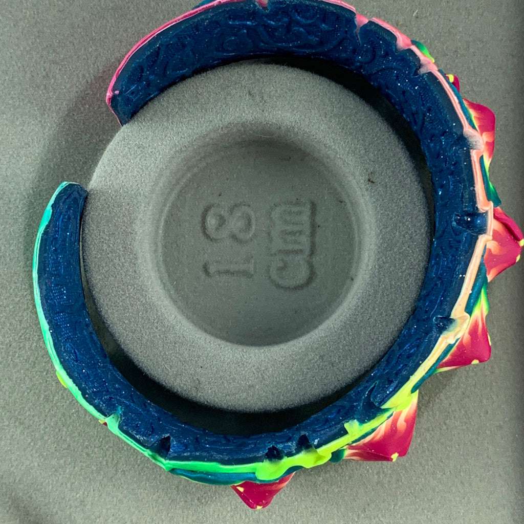 Rennique designer wearable art tropical cuff bracelet featuring sculptural floral petals in vibrant colours with 18 cm size reference.