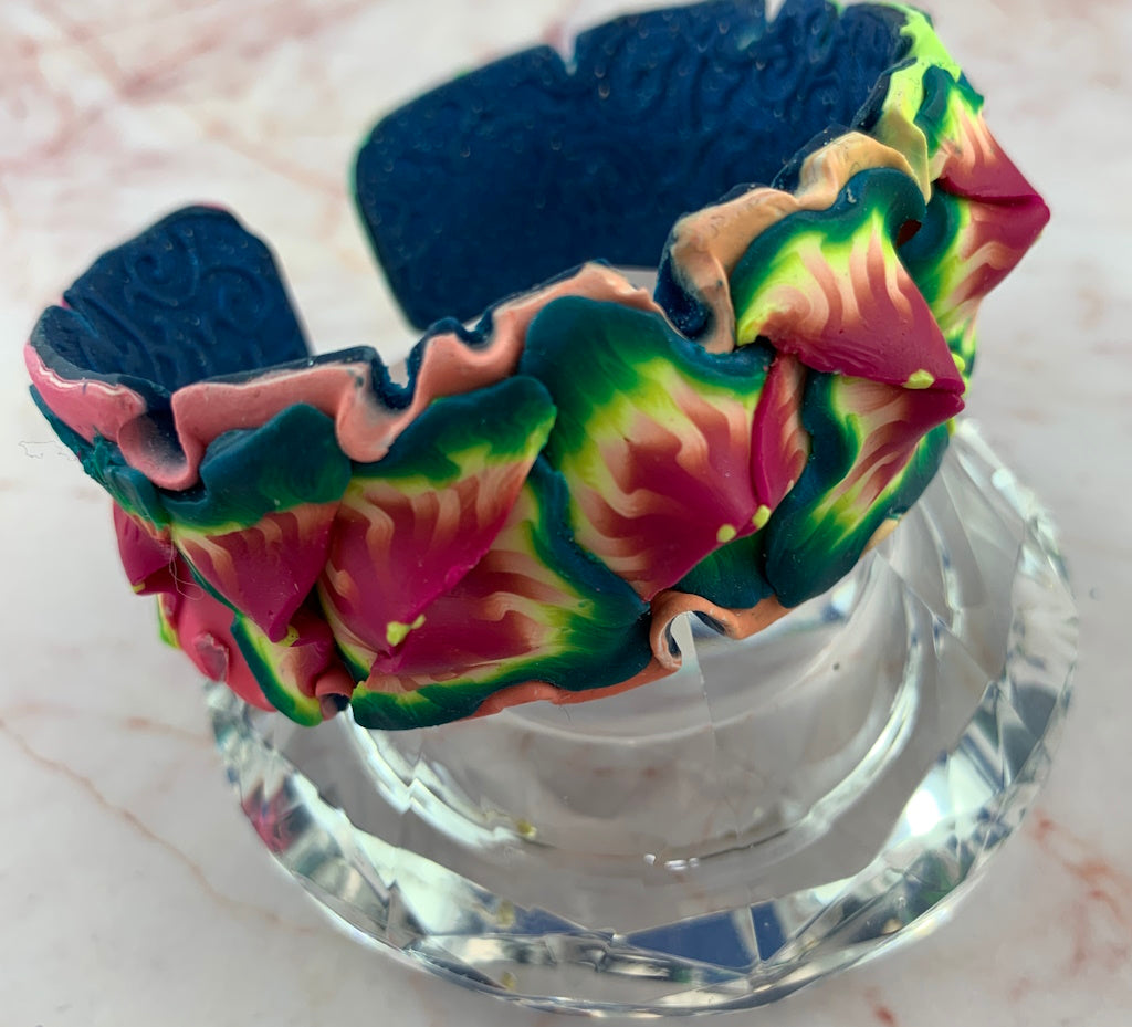 Rennique Studio wearable art tropical floral statement cuff bracelet handmade from polymer clay in vibrant pink, green and blue colours.