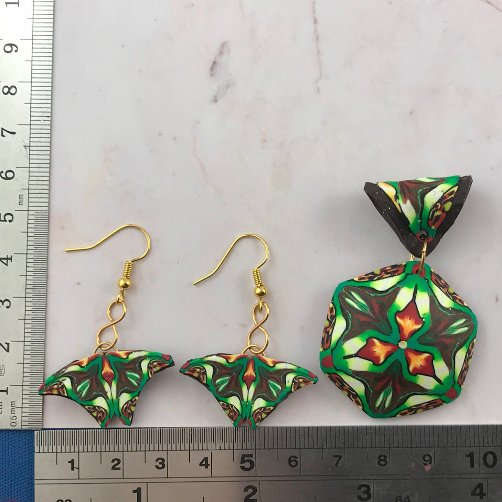 Rennique tropical-themed jewellery set with matching butterfly drop earrings and hexagon pendant shown with ruler for size reference.