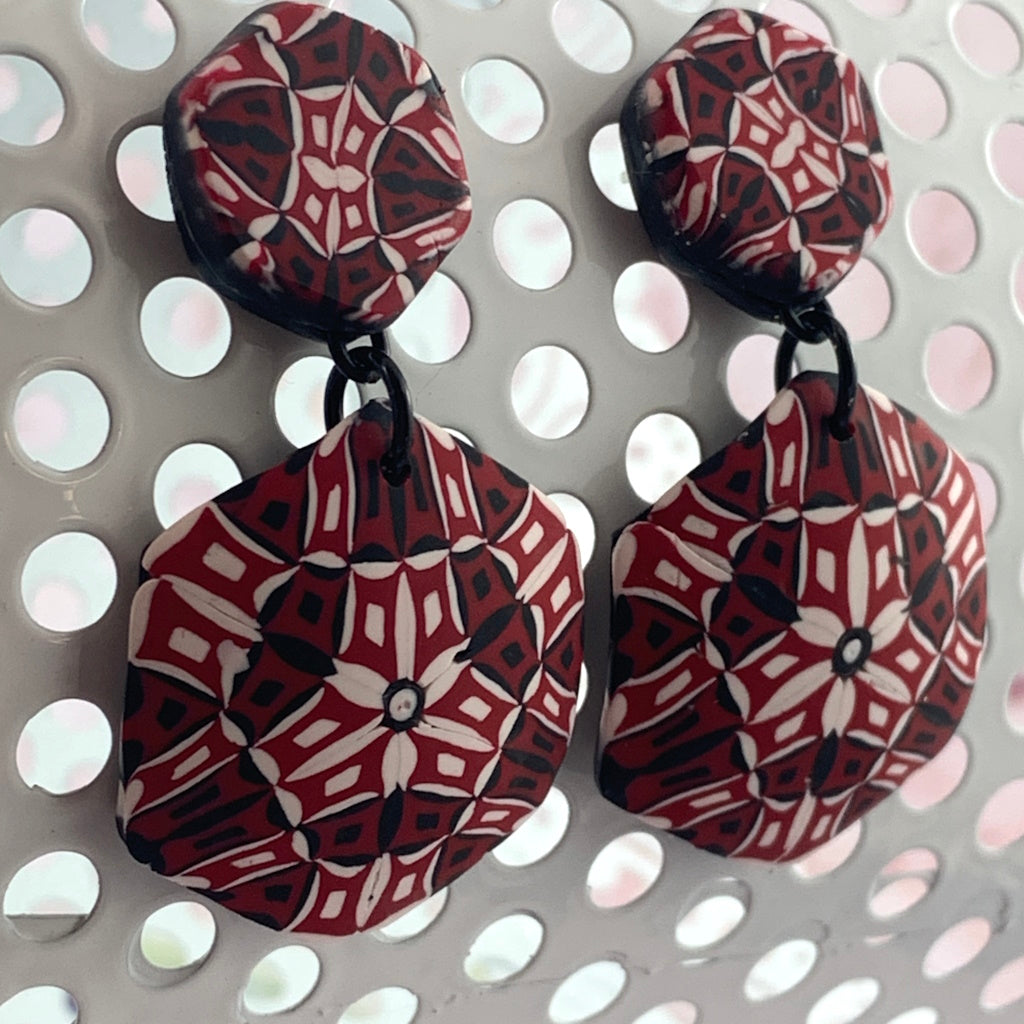 Rennique wearable art handmade drop earrings featuring bold red, black and white geometric mosaic pattern in statement design.
