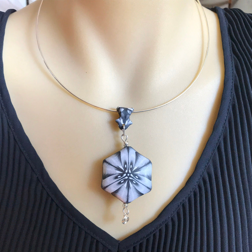 Statement black white polymer clay pendant necklace worn on silver neck ring, elegant handmade monochrome jewellery Australia