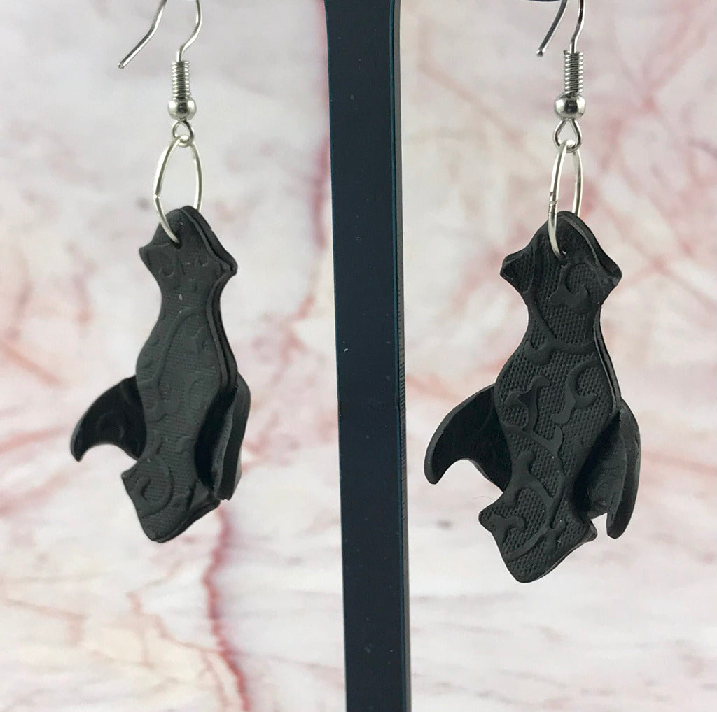 Back view of handmade black polymer clay earrings showing textured reverse pattern and sculpted artisan finish, handmade in Australia