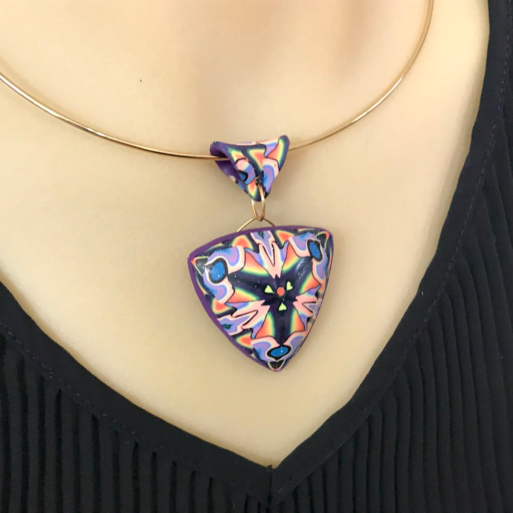 Handmade triangular polymer clay statement necklace worn on neckline by Rennique Australia.