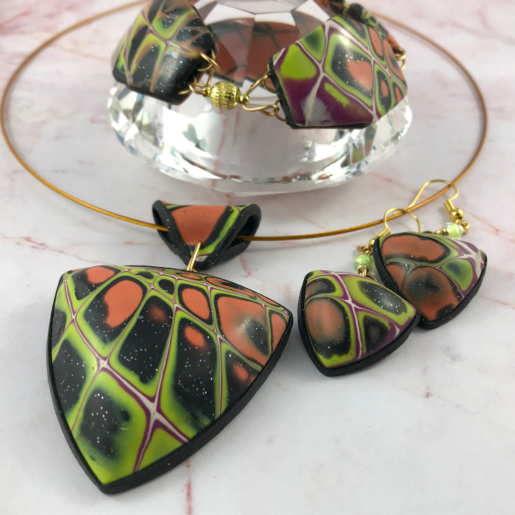 Unique polymer clay bracelet with abstract multicolour pattern, curved lightweight beads and hand-linked wire connections, one of a kind artisan jewellery Australia